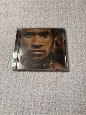 Usher Brown and Gold Portrait CD Cover